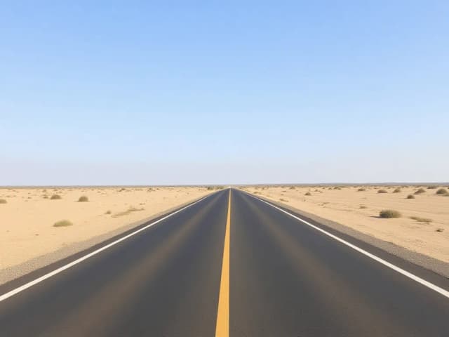 Desert road under clear sky, before sky replacement.